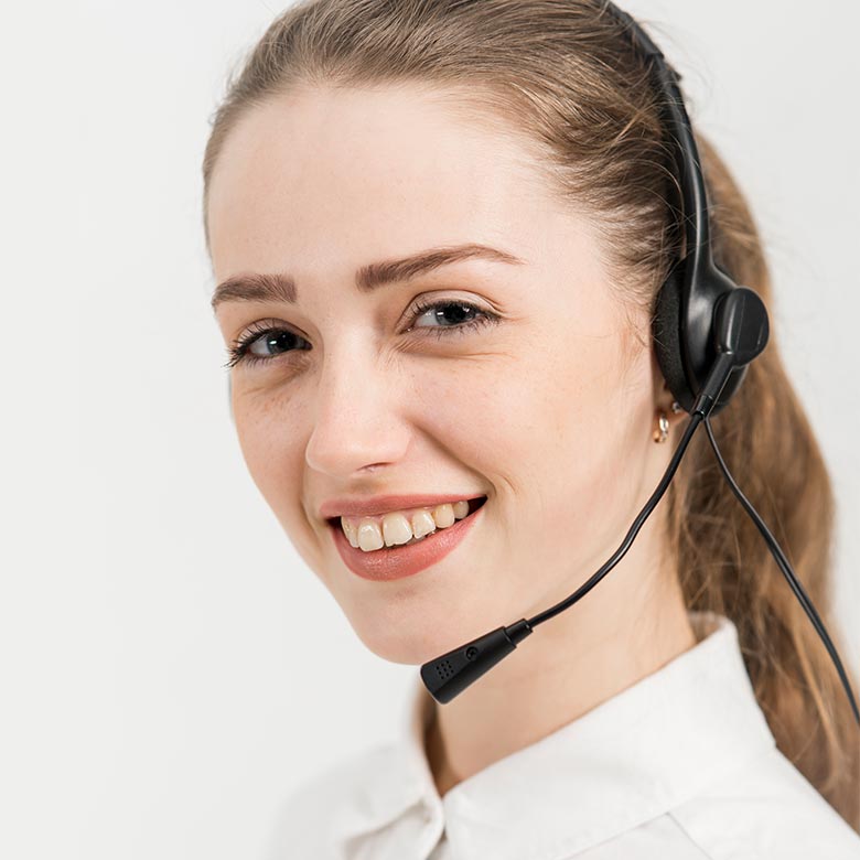 A close up portrait photo of a young blond women wearing a headset.